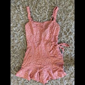 Pink romper from Hollister with a tie. Size S